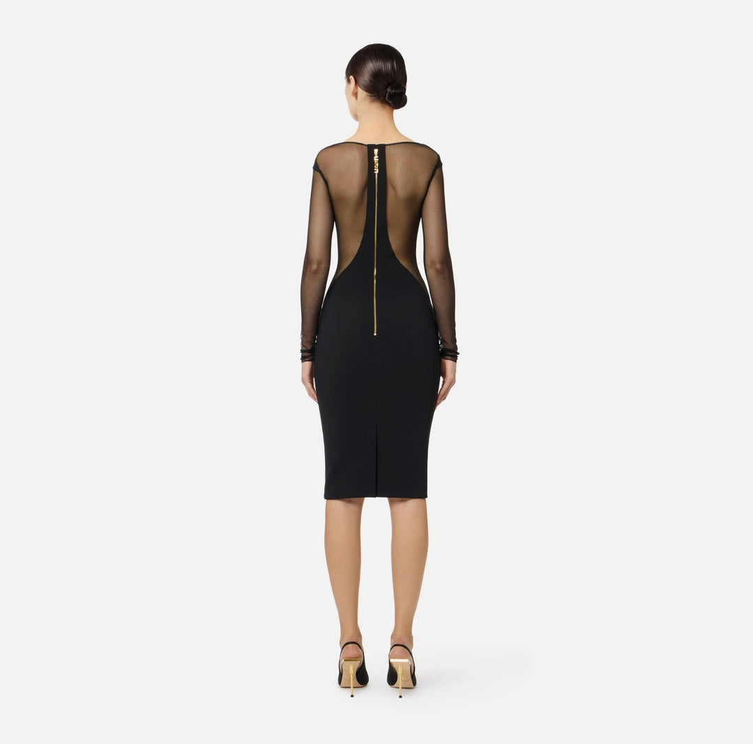 Dress in lightweight crêpe and tulle fabrics with cut-outs