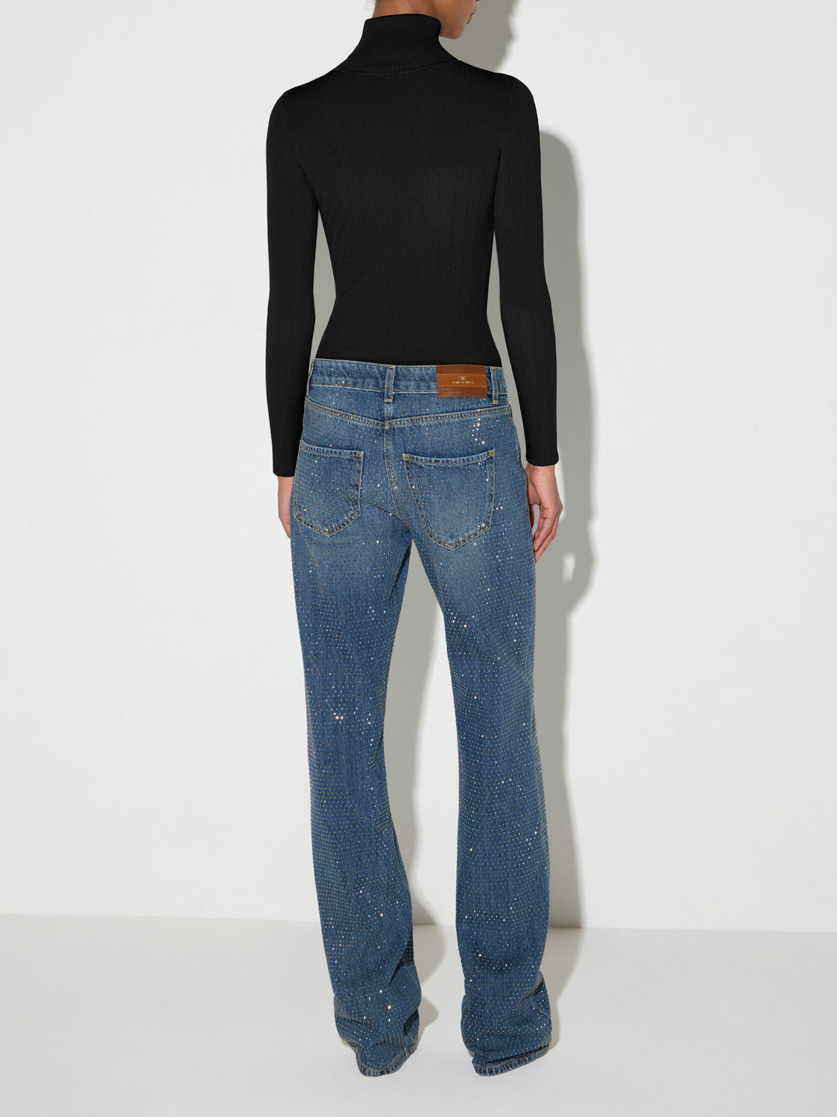 Knit turtleneck top with openwork embroideries