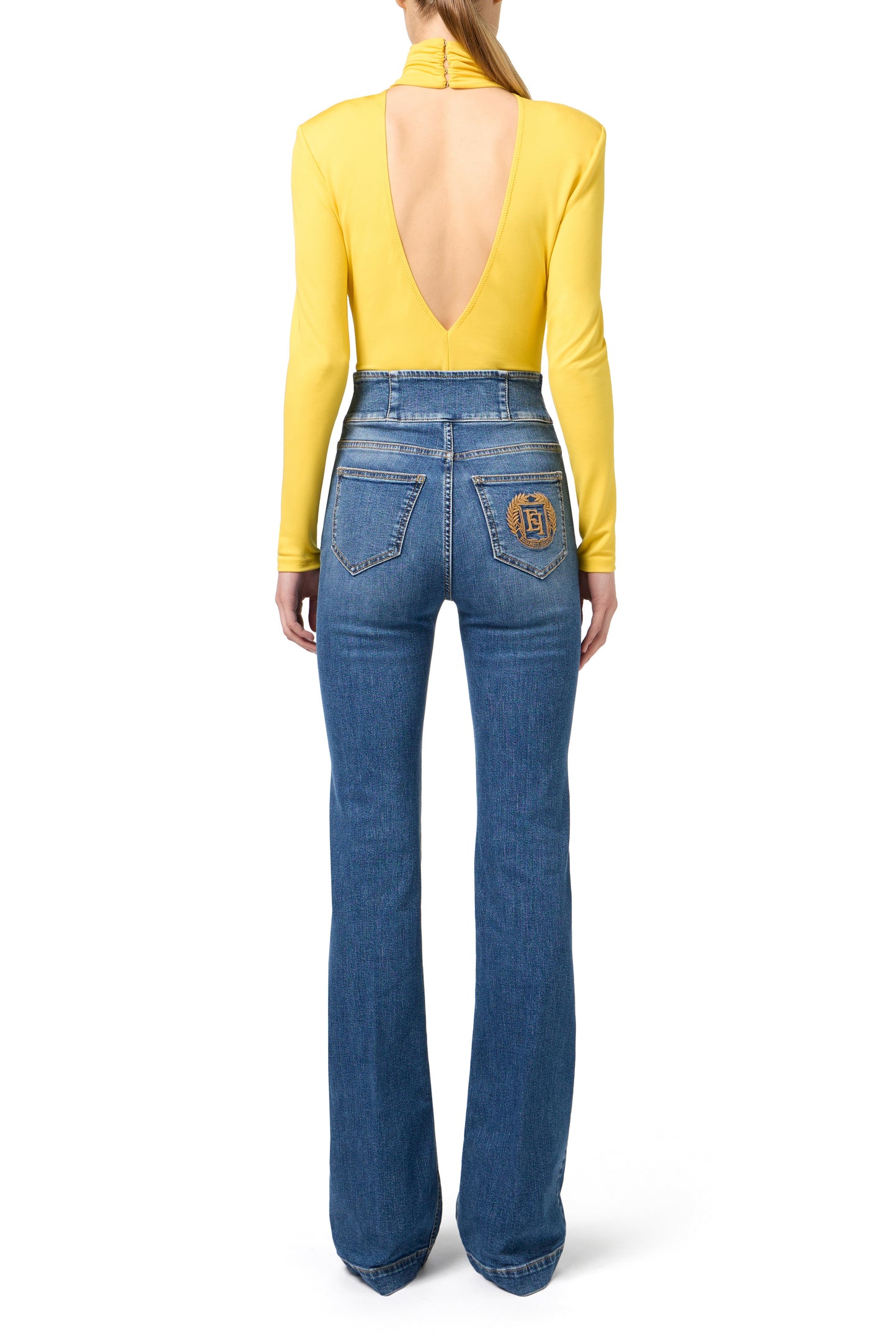 Bell-bottom stretch cotton jeans with central button placket