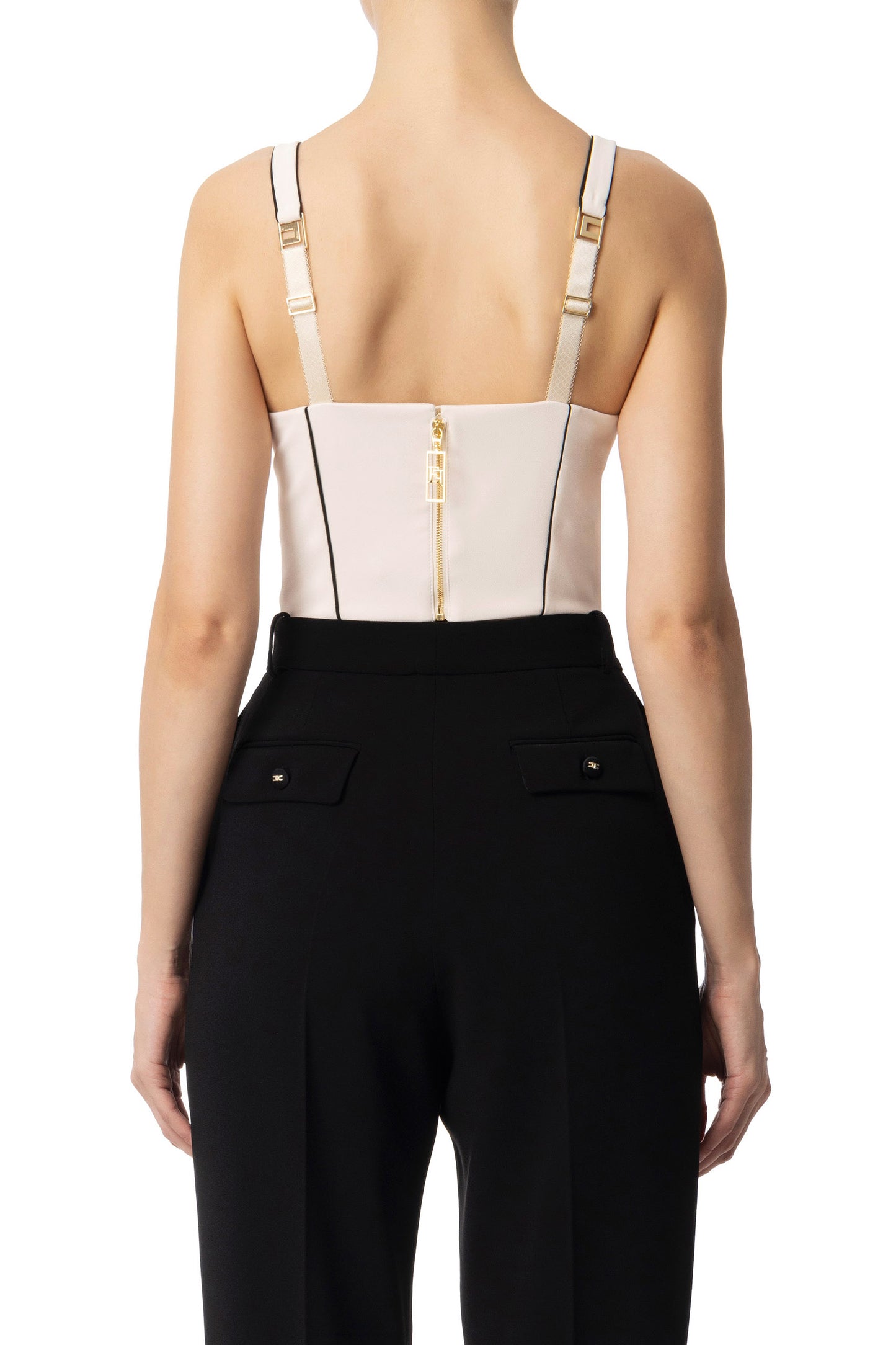 Women's bustier featuring a cream-colored base with black profiles