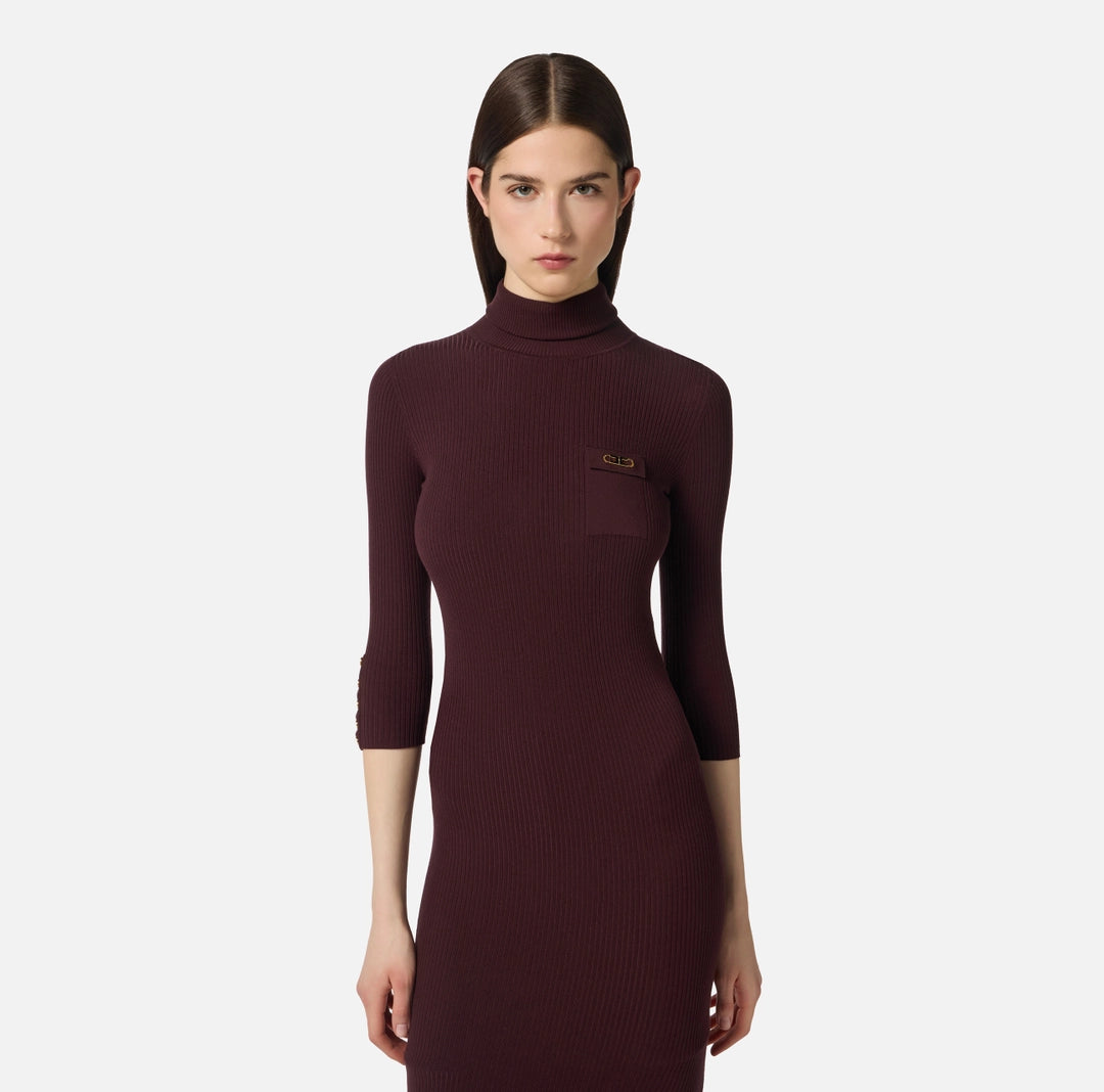 Dress in ribbed knit fabric with breast pocket