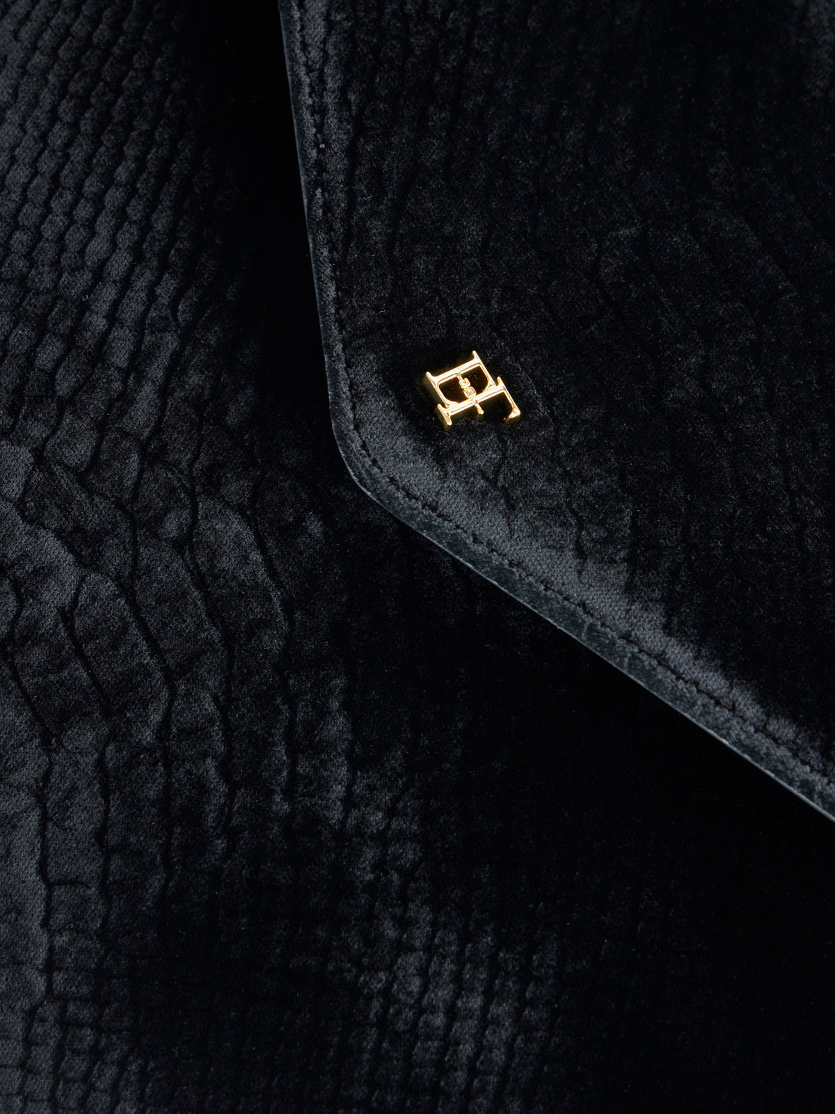 Over-the-shoulder bag made from velvet with a crocodile print texture