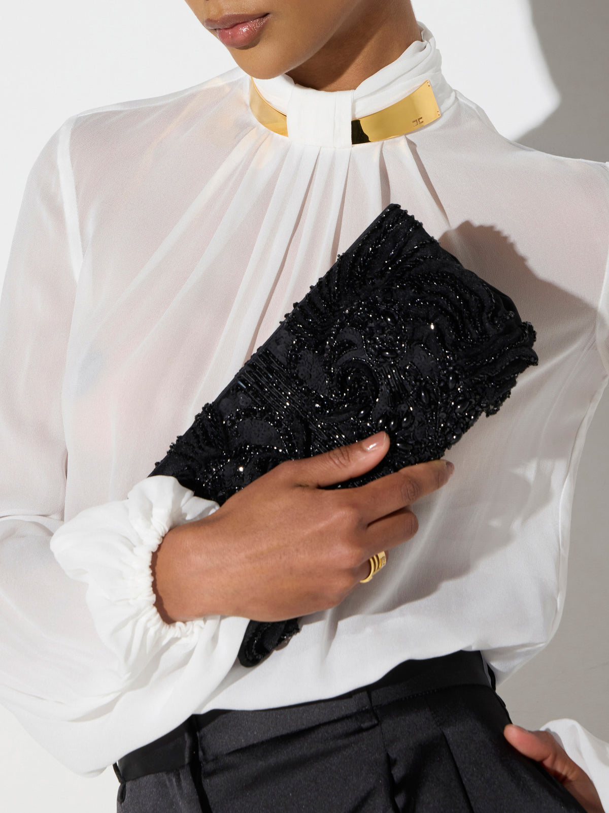 Satin clutch bag with crystals
