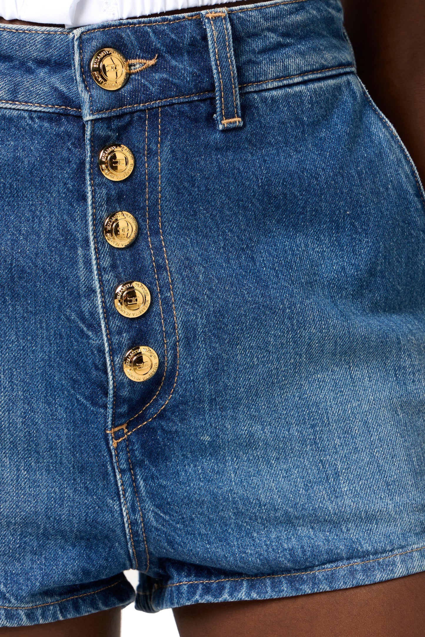 Denim shorts with visible buttons