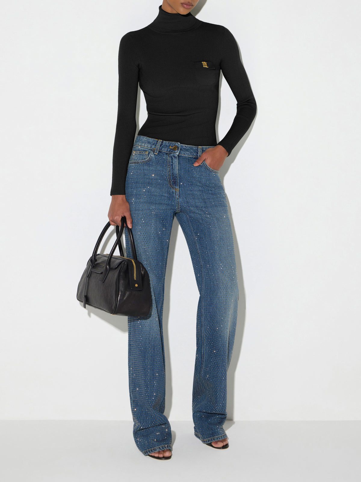 Knit turtleneck top with openwork embroideries