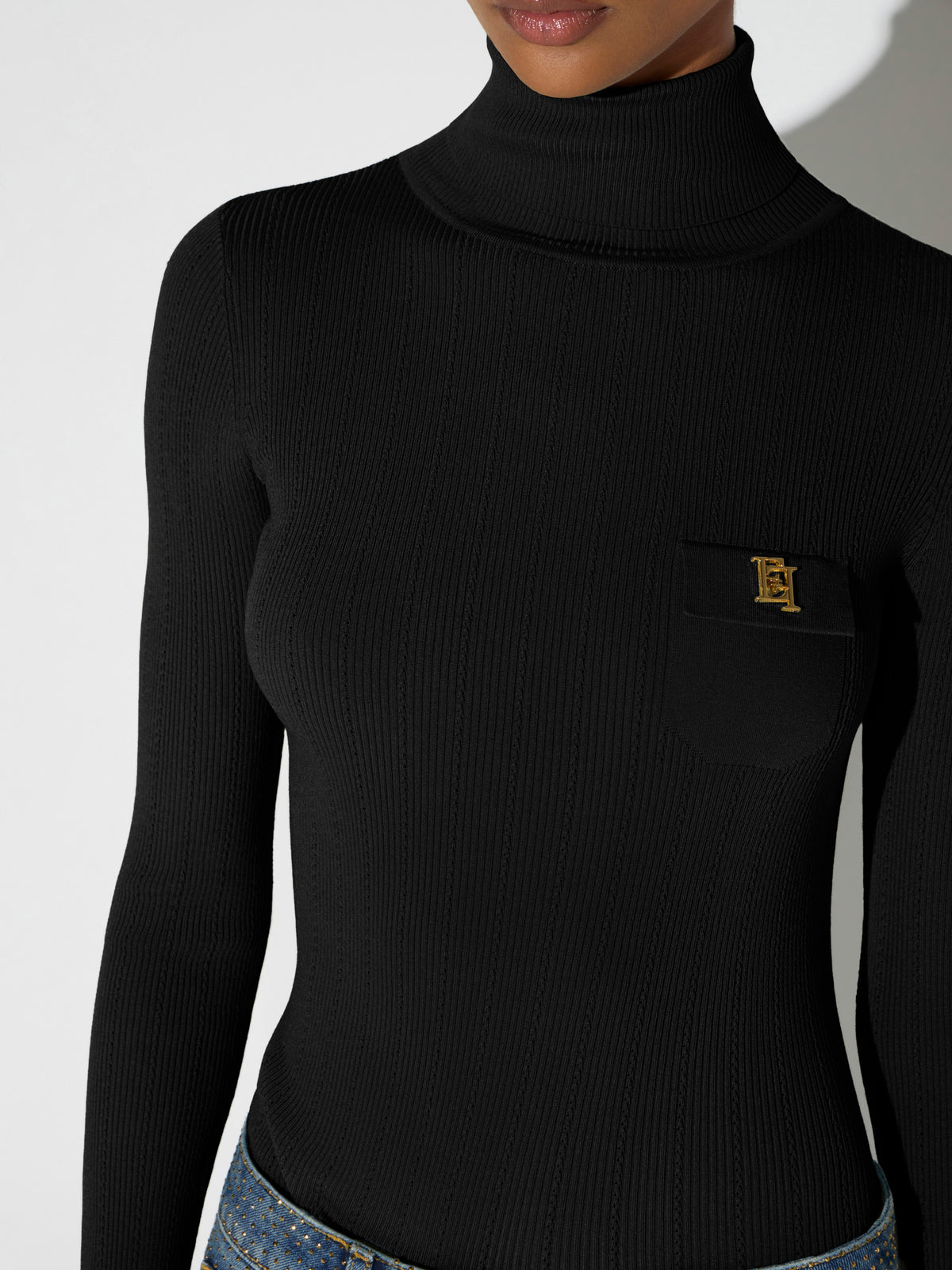 Knit turtleneck top with openwork embroideries