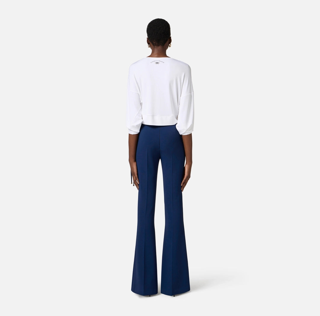 Crêpe bell-bottom trousers with criss-cross laces