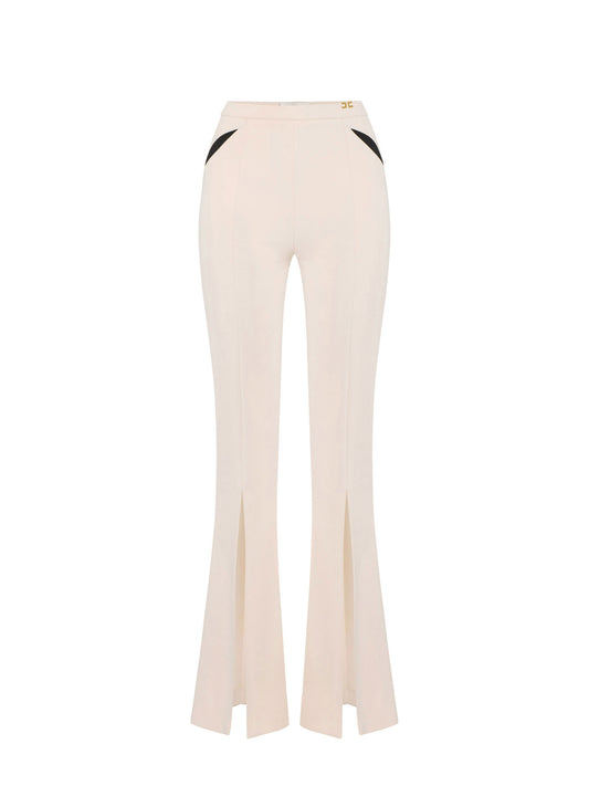 Trousers in lightweight crêpe fabric with cut-outs and slits