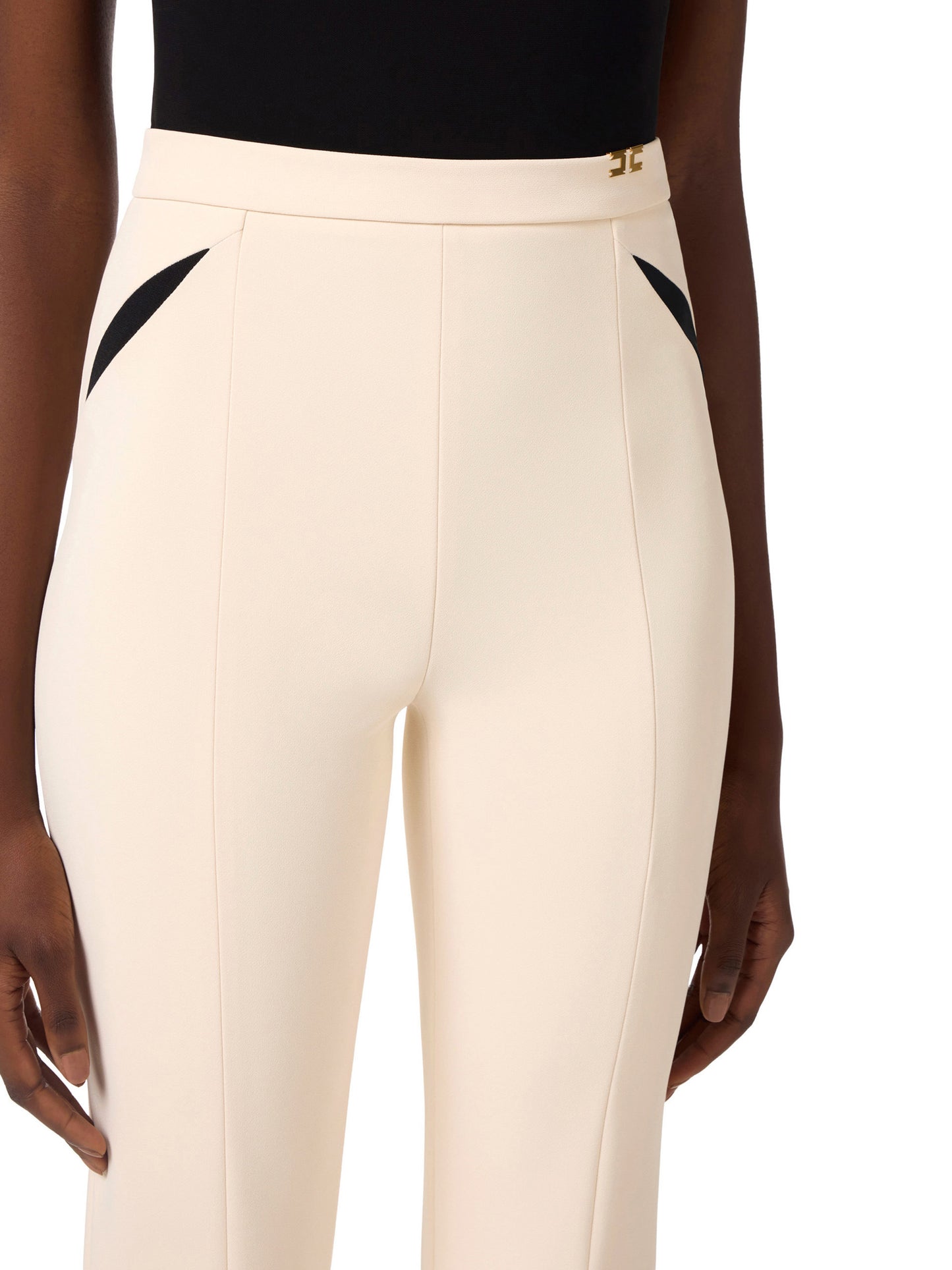 Trousers in lightweight crêpe fabric with cut-outs and slits