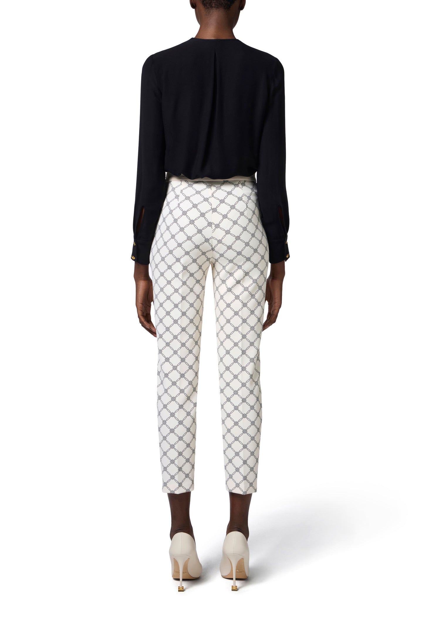 Trousers in crêpe fabric with diamond print