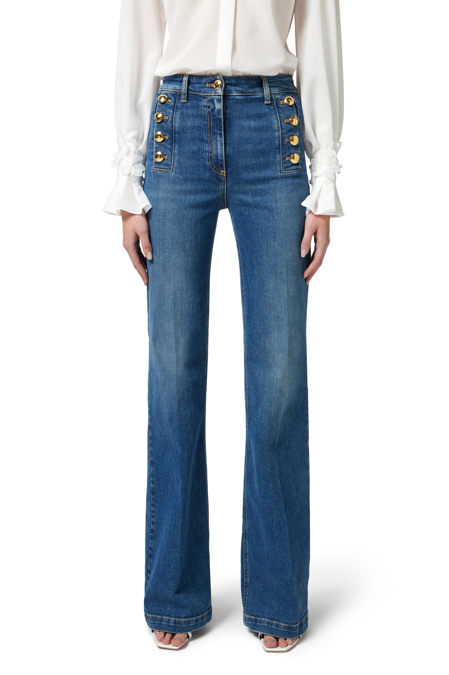 Bell-bottom jeans with row of buttons