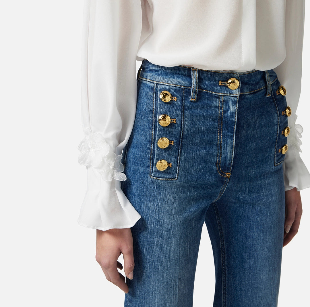 Bell-bottom jeans with row of buttons